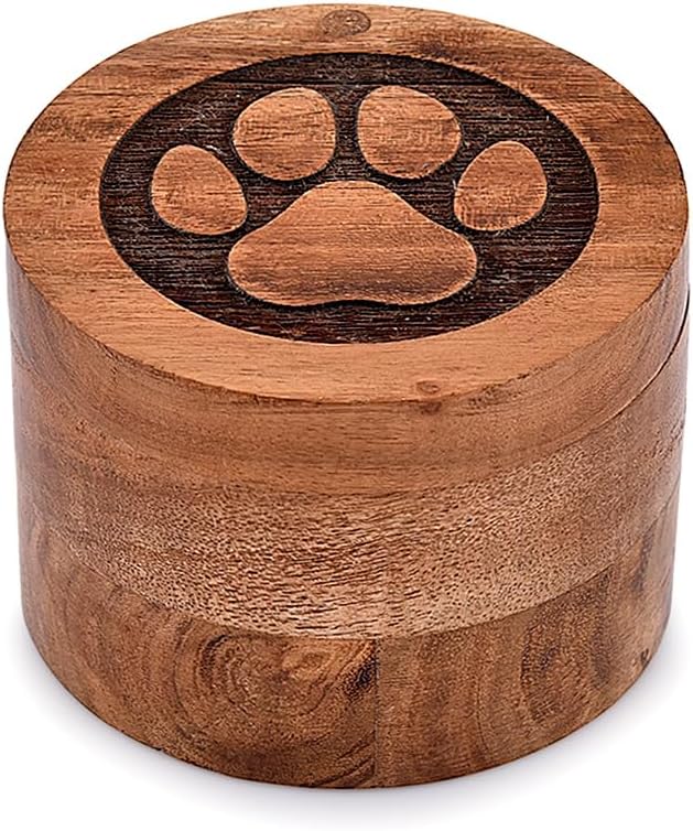 Close up of hand carved paw print on acacia wood pet urn