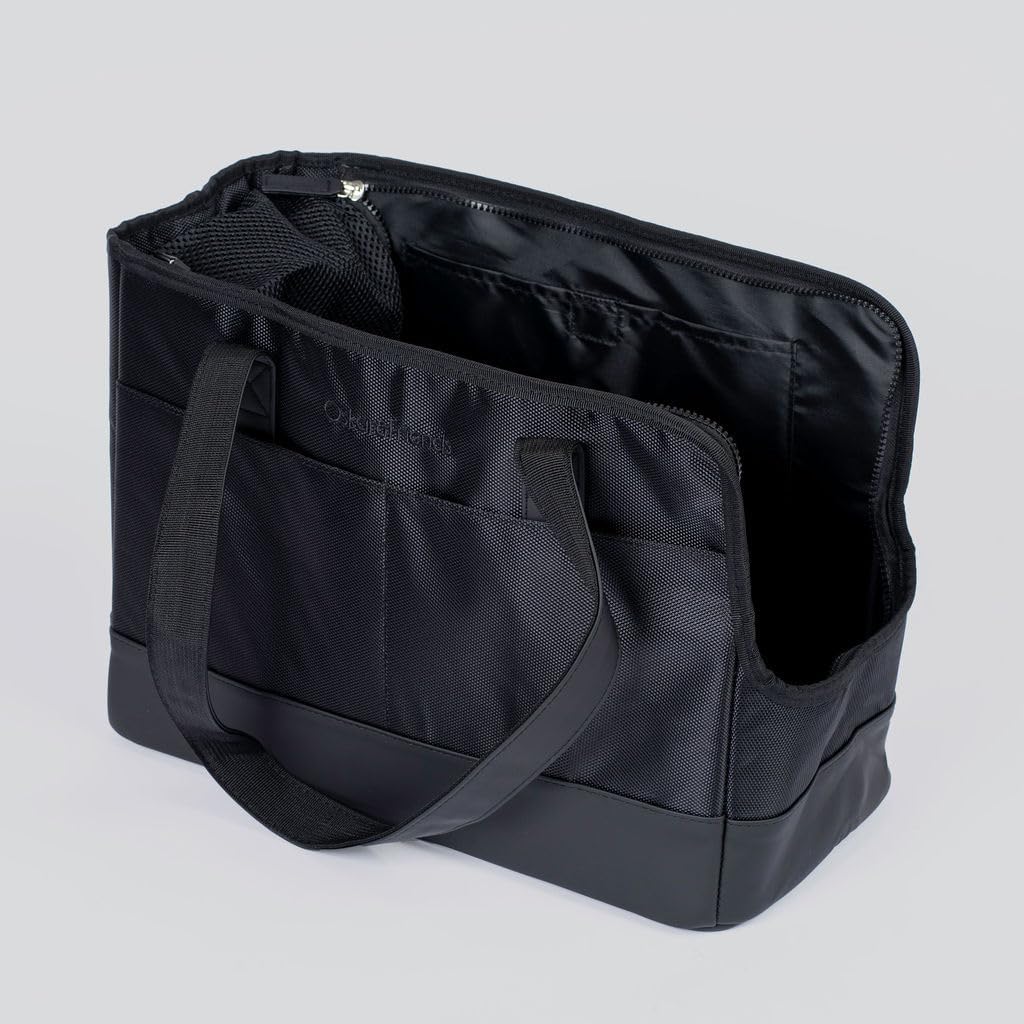 Model carrying Oskar and Friends pet tote bag