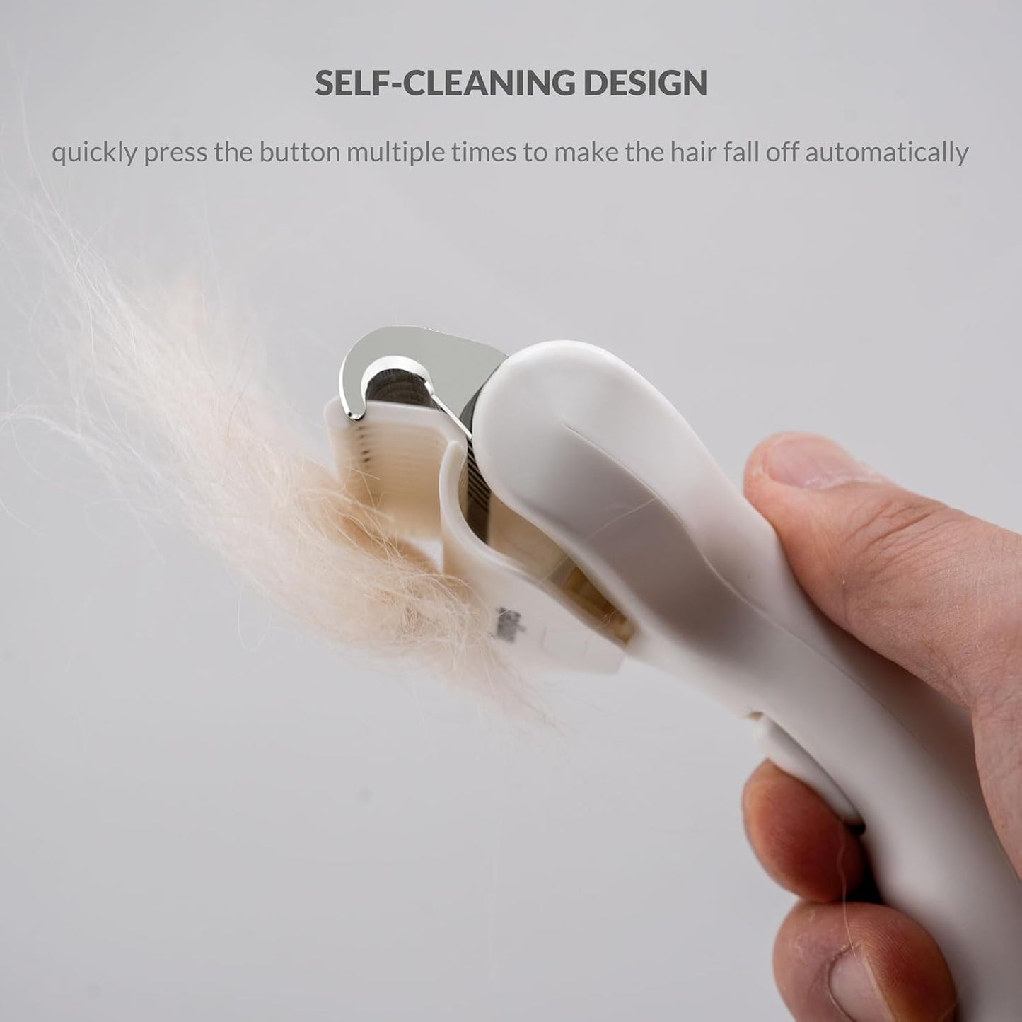 Taomypets grooming brush showing self-cleaning button mechanism