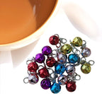Multi-colored round metal bells for small animal collars