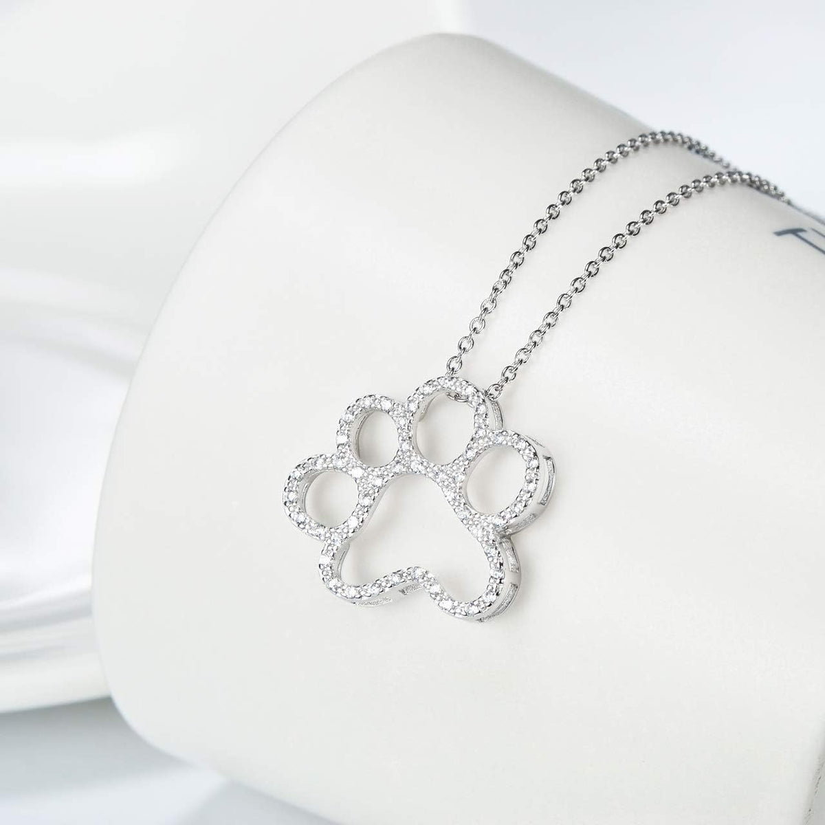 ONEFINITY 925 sterling silver paw necklace displayed inside its exquisite gift box