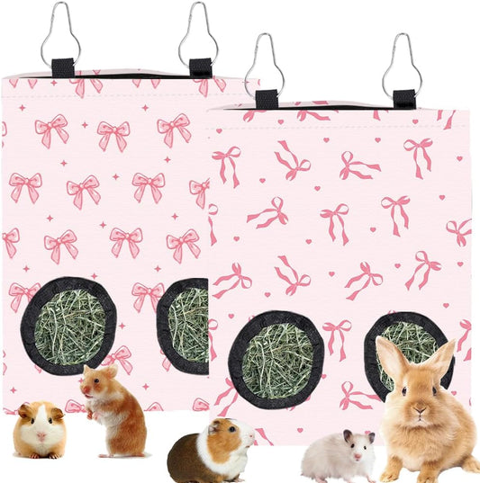 2Pcs 2 Styles Small Pet Hanging Hay Bag Pink Hay Feeder Bag with 2 Holes Bowknot Pattern Cloth Washable Rectangle Feeding Storage for Rabbit Chinchillas Hamsters Guinea Pigs 12 x 9 Inch - Image 1