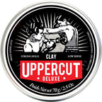Uppercut Deluxe Clay 2.5 Ounces front view tin containing strong hold matte hair pomade.