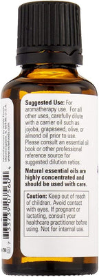 Steam distilled lavender essential oil from NOW Foods displayed next to fresh lavender flowers