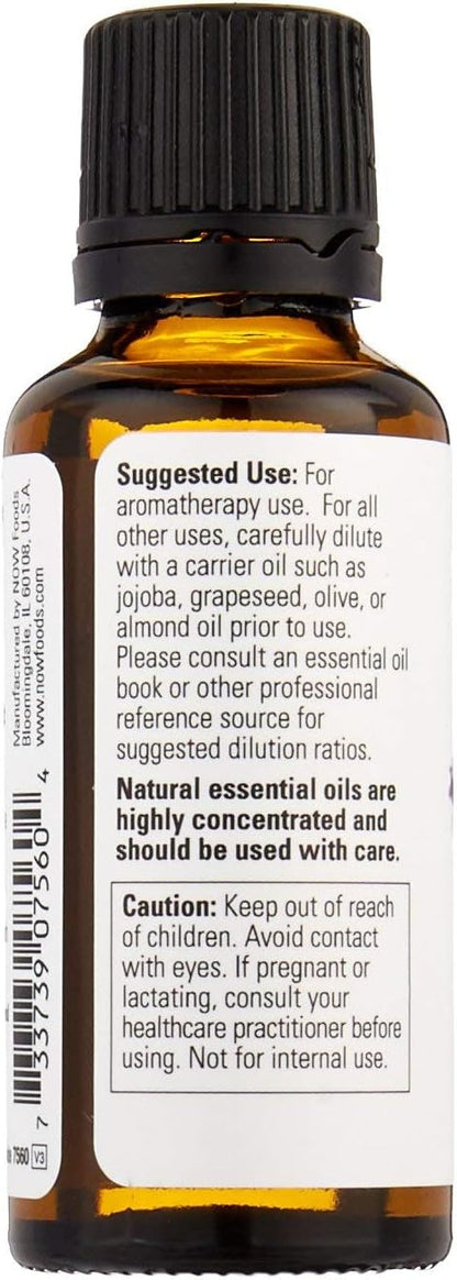 Steam distilled lavender essential oil from NOW Foods displayed next to fresh lavender flowers