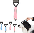 Hand holding pink and grey pet grooming brush for scale