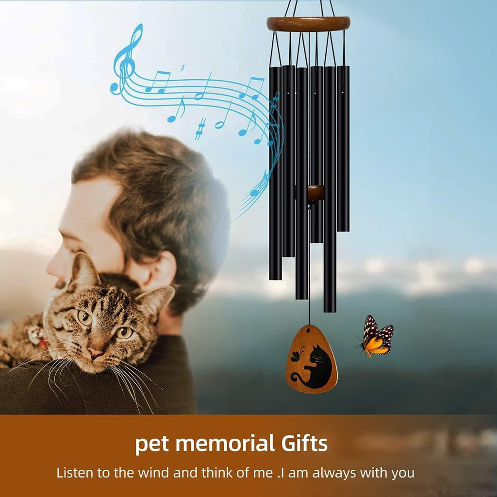 Close up of cat memorial wind chime hanging in garden