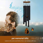 Close up of cat memorial wind chime hanging in garden