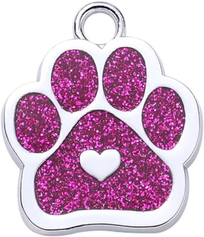Close up of custom laser text engraving on metal pet tag.