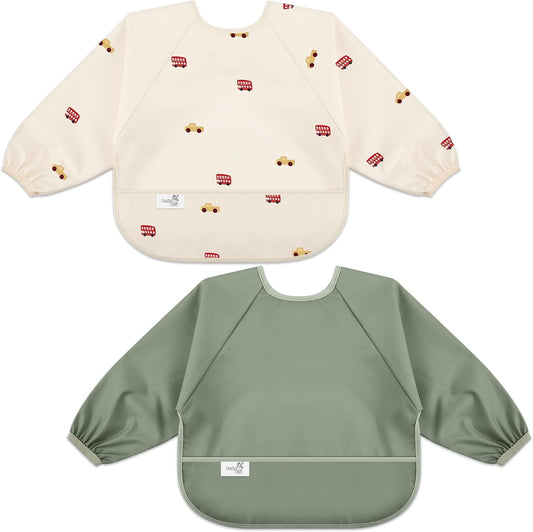 BebeBiu long sleeve baby bib front view showing the waterproof fabric and wide catch-all pocket for feeding protection.