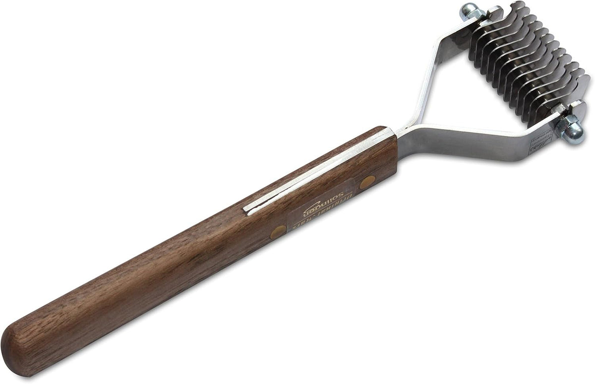 Close up of 12 stainless steel blades on Mars Coat King tool