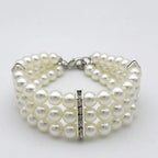 Adjustable purple imitation pearl pet choker with rhinestone heart charm close up view for small dogs