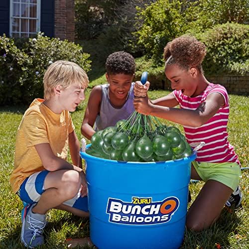 Kids holding premium ZURU grenade water balloons preparing for an outdoor backyard summer battle