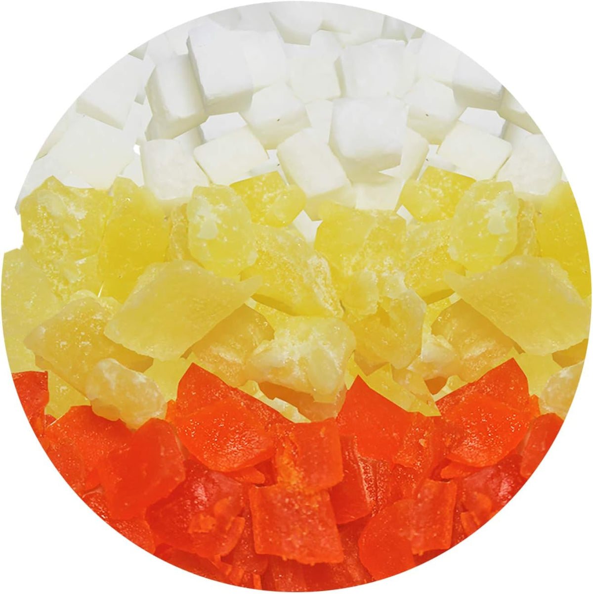 Close-up view of mixed dried fruit treat pieces including papaya coconut and pineapple