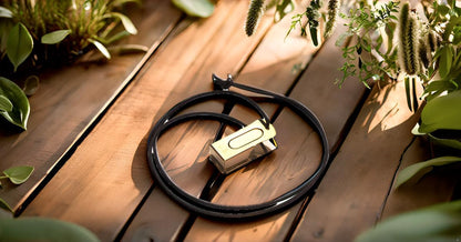 Handheld metal pet training clicker showing robust spring steel construction.