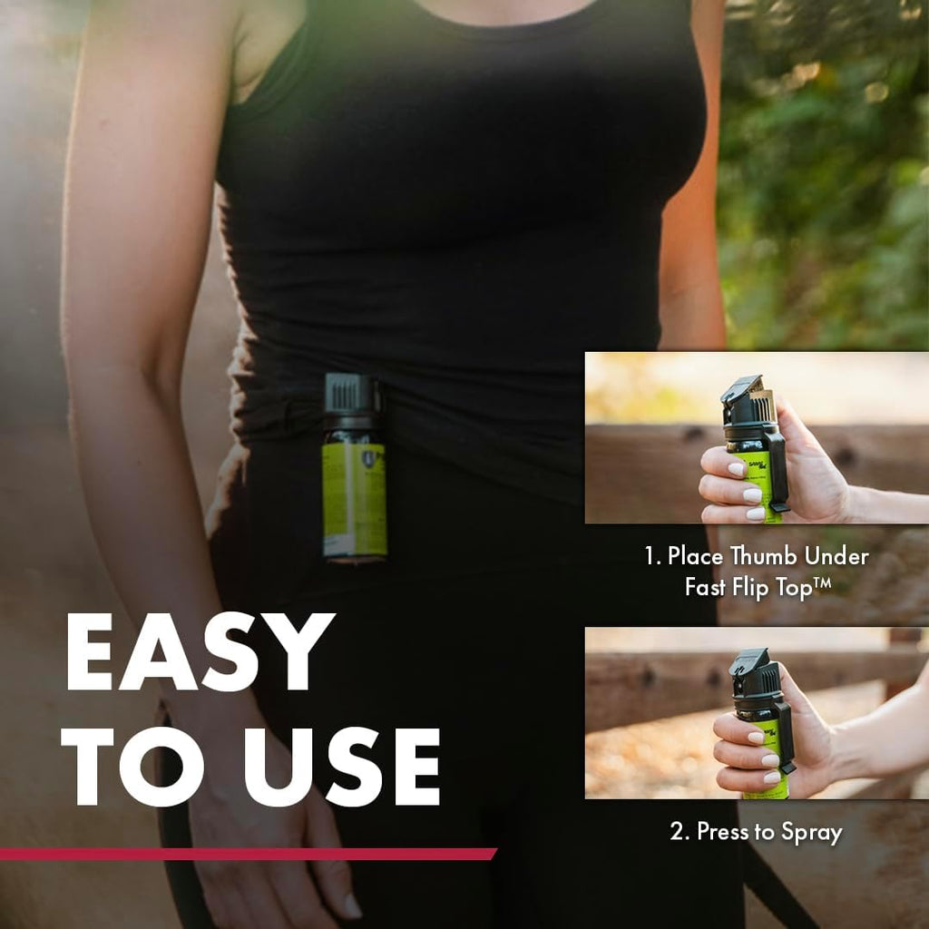 Person holding Sabre dog spray to demonstrate scale and usage