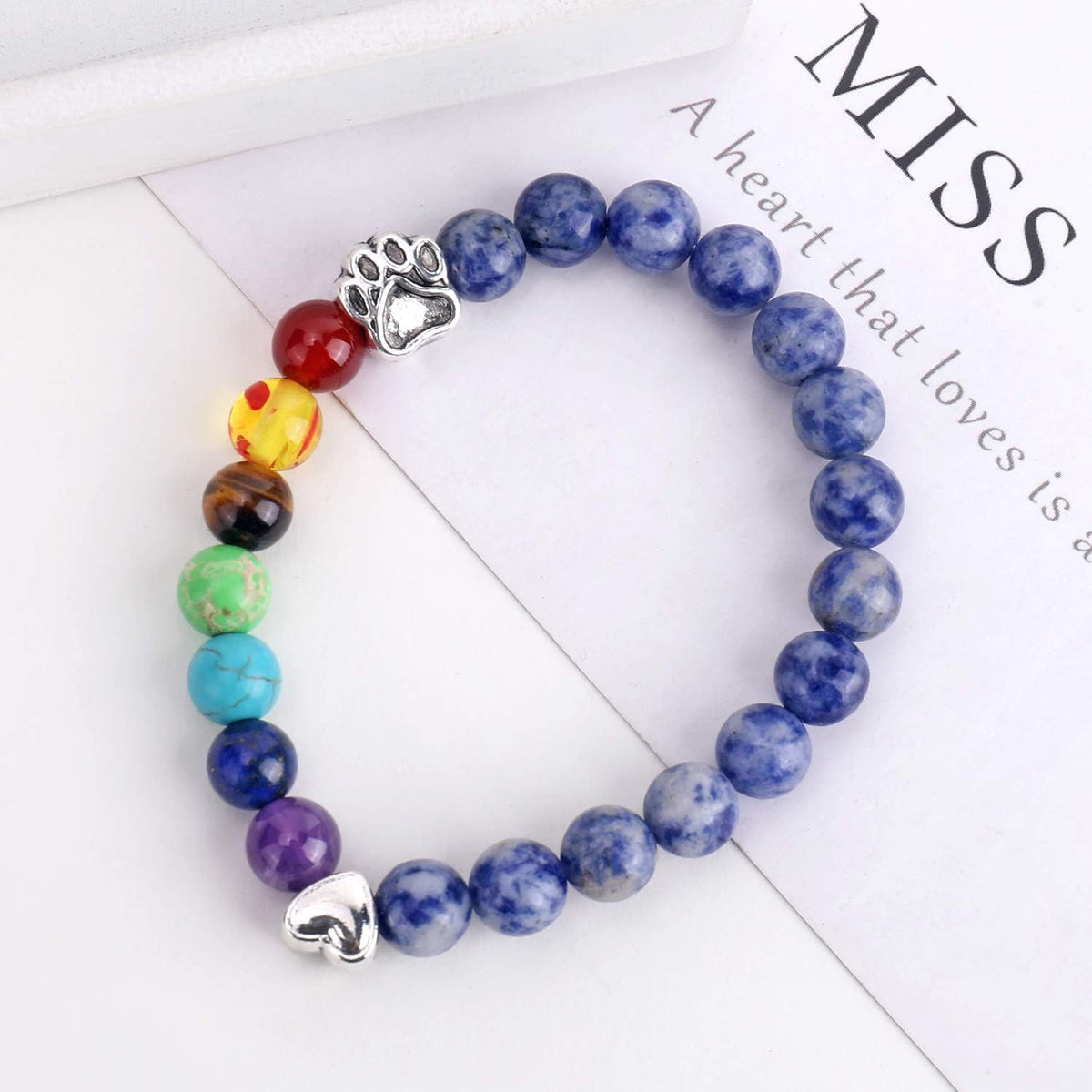 Unijew pet sympathy bracelet displayed alongside its blessing card and pouch