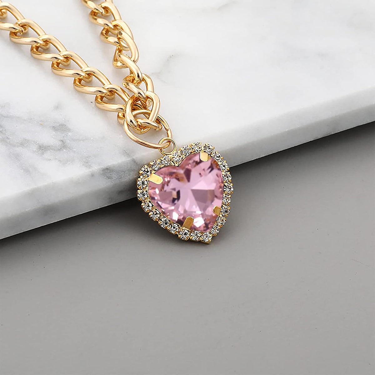Lightweight sparkling pet costume accessory close up look at the pink gemstone heart