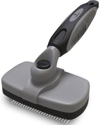 Pawradise deshedding tool showing loose undercoat fur being pushed off the brush
