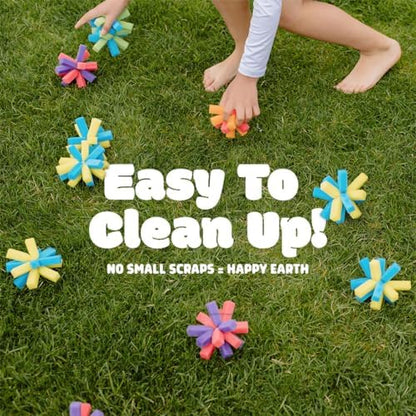 Chuckle And Roar forty pack vibrant sponge water balls spread out on grass for outdoor family fun.