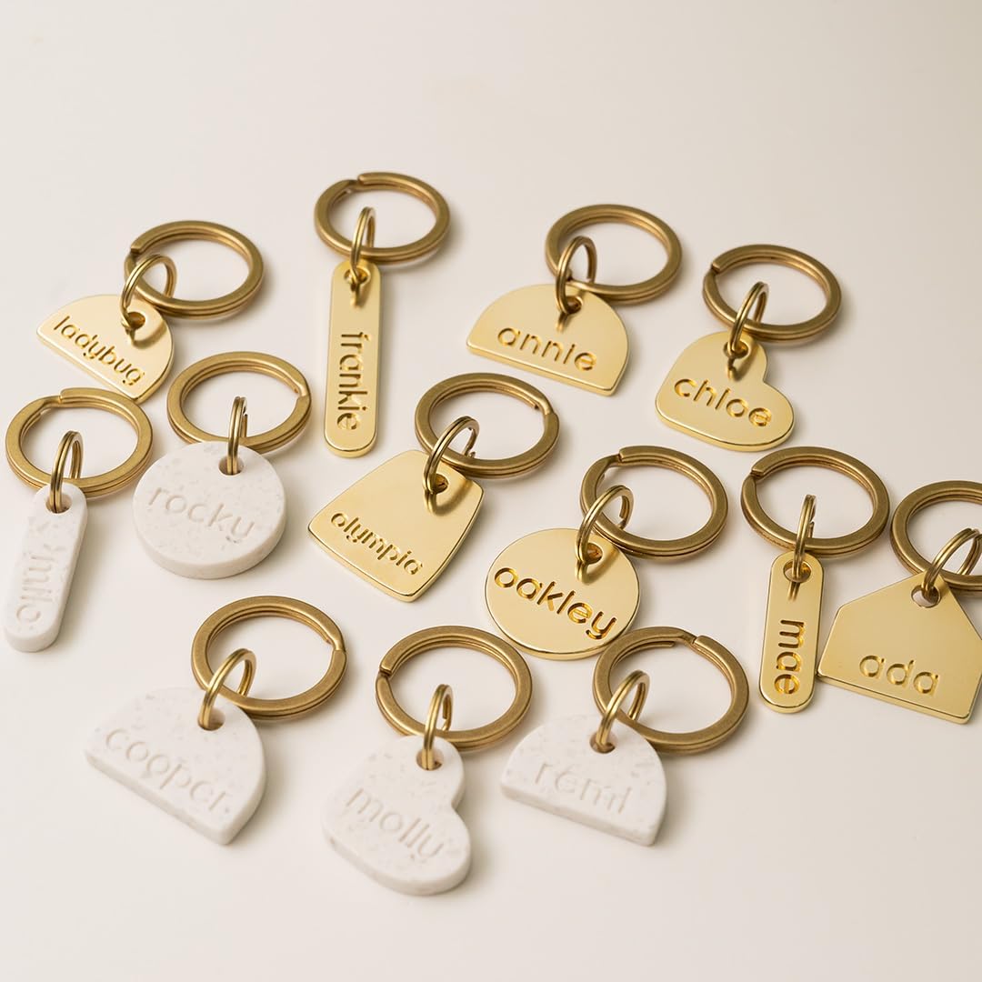 Onoma premium stone look silent cat identity tag with brass hardware.