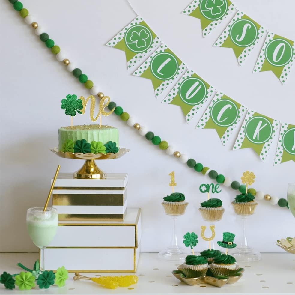 Detailed view of gold glitter 1st birthday cake toppers