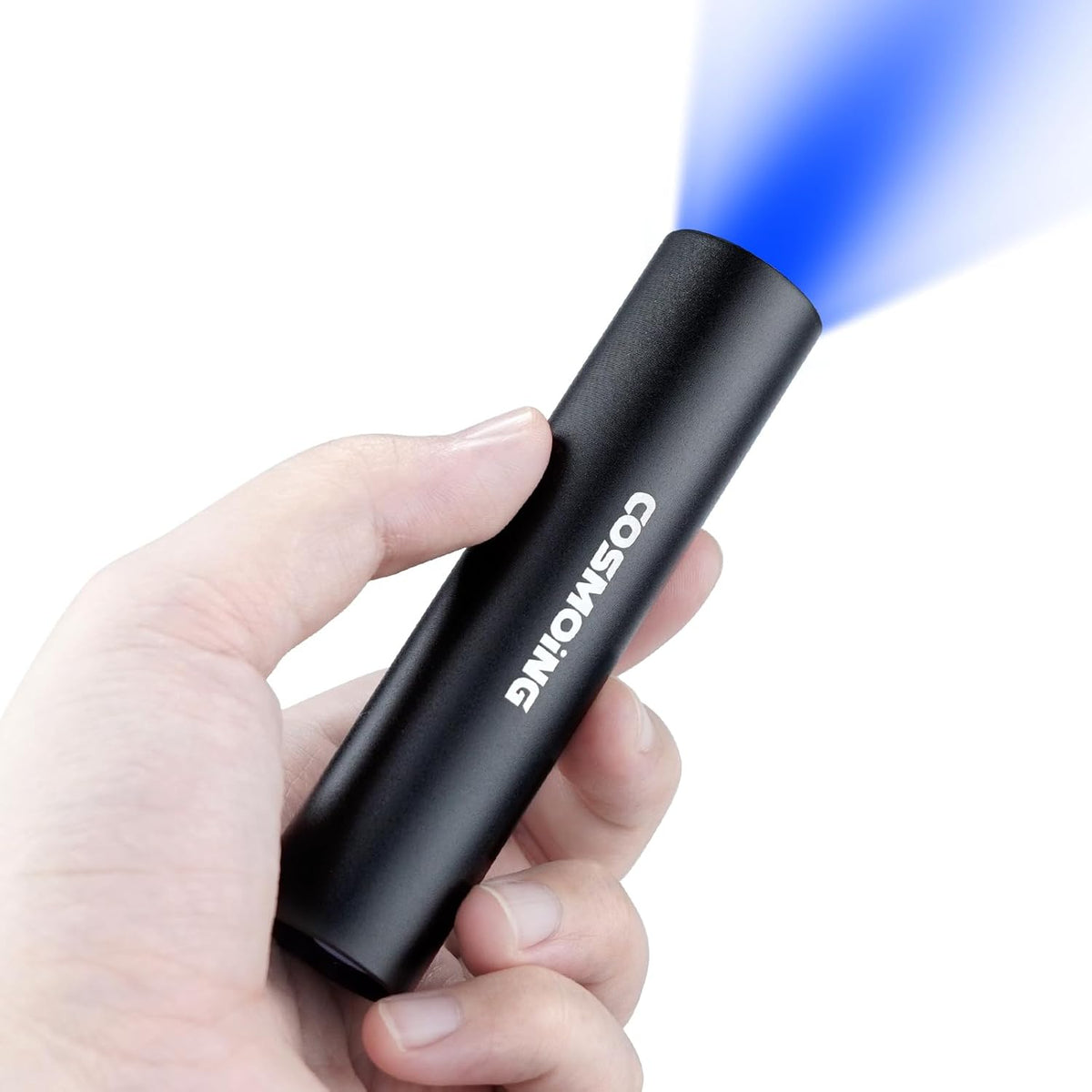 Darkbeam 365 nanometer handheld light revealing dried organic spots on hotel bedding fabric.