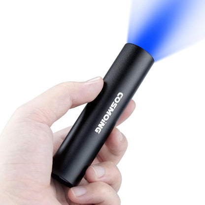 Darkbeam 365 nanometer handheld light revealing dried organic spots on hotel bedding fabric.