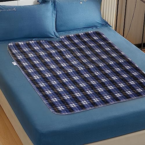 Washable incontinence sheet pad spread across a standard mattress demonstrating generous surface coverage