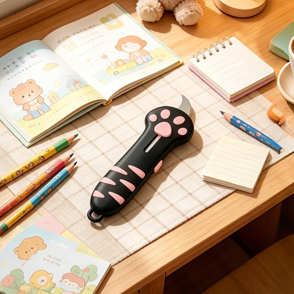 Kawaii pink cat shaped utility knife handle with soft textured paw pads for ergonomic grip