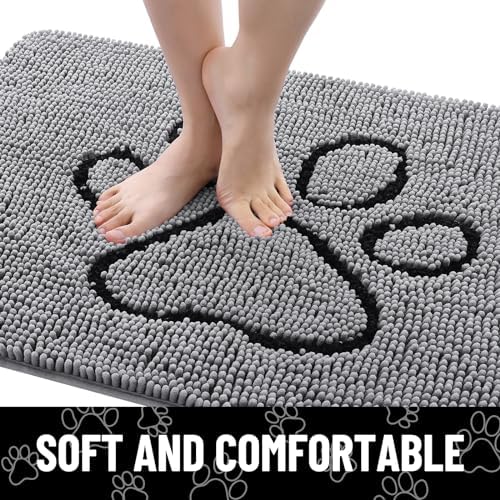 Grey and black Smiry dog door mat catching dirt in a home lobby