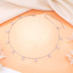 Model wearing the minimalist animal paw print silver statement necklace adjusted to a tight choker length.
