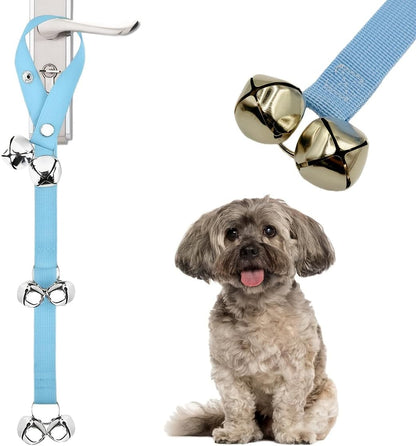 Dog using potty training bell on door handle