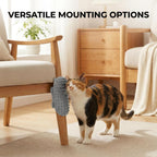 Cat self groomer mounted on a wall corner for feline massage.