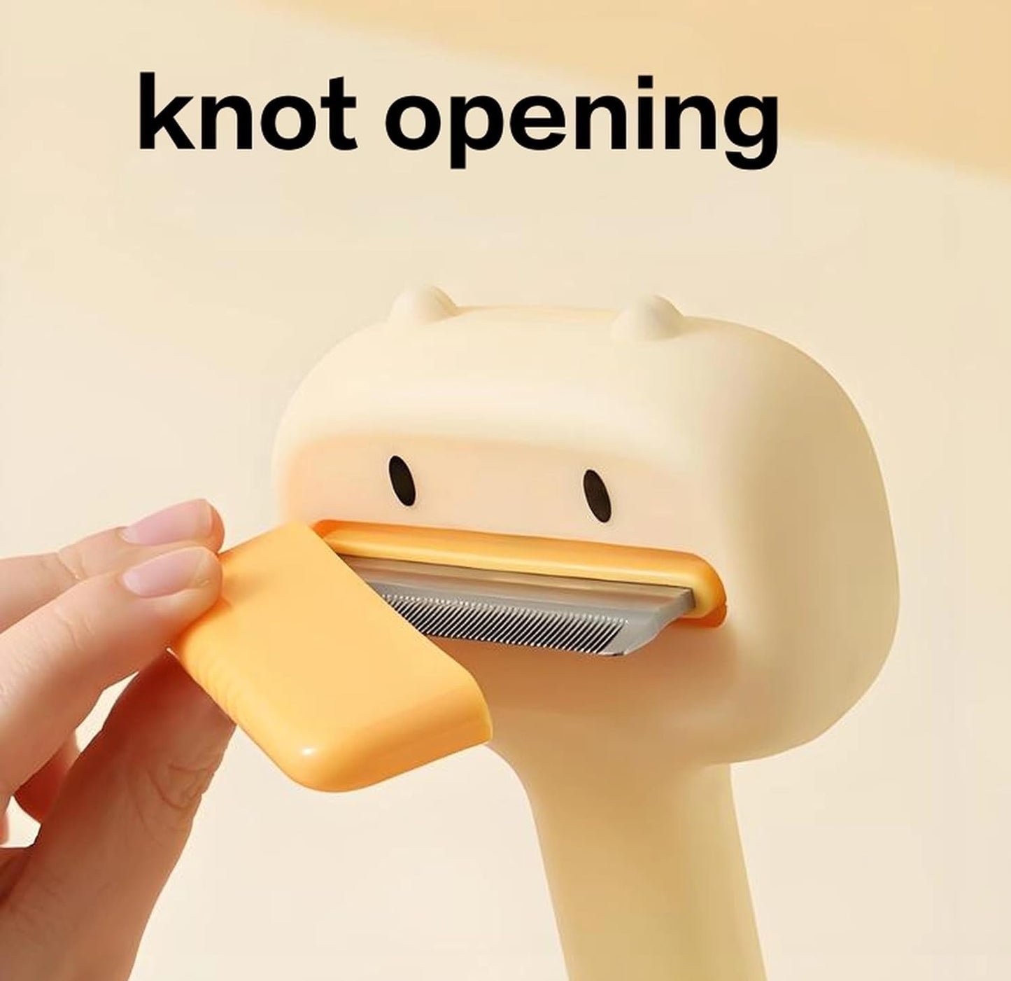 Duck shaped slicker comb for dogs and cats displaying stainless steel pins.