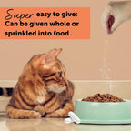Feliway Cystease oral supplement capsules poured out next to bottle