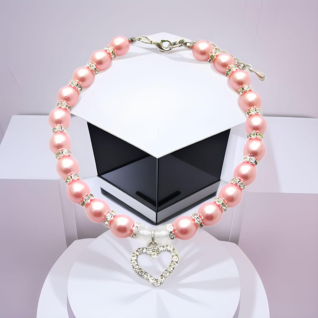 Pink pearl dog collar with rhinestone heart charm pendant close up