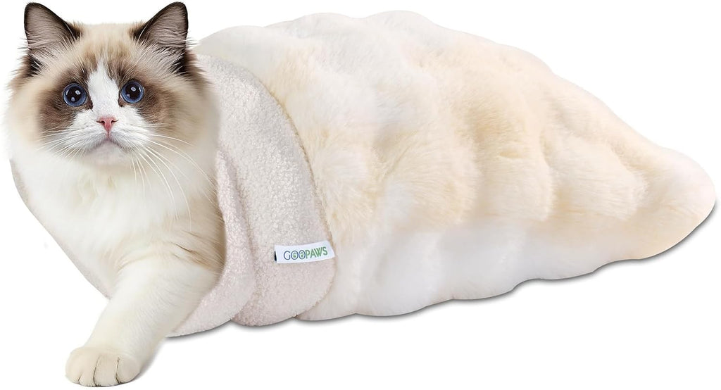 Goopaws sage green cat bed in a living room setting