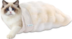 Goopaws sage green cat bed in a living room setting