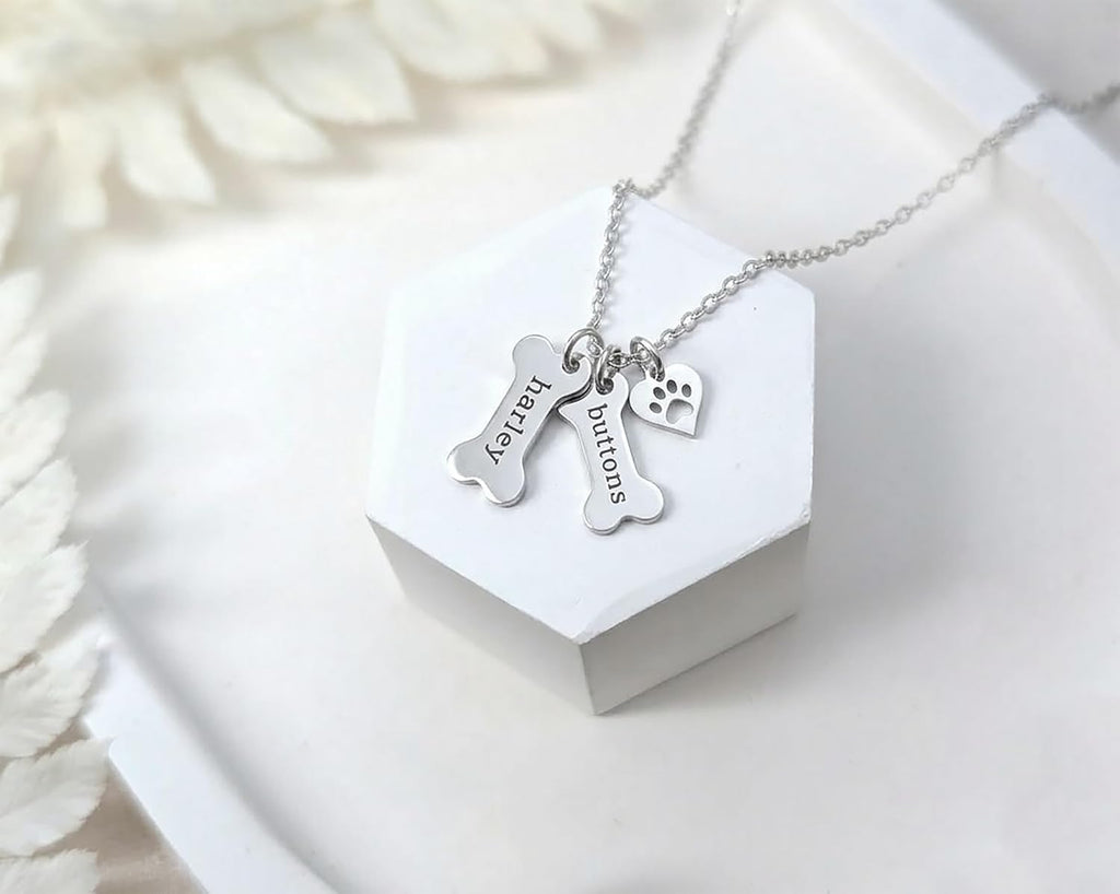 Customized dog bone name pendant for pet lovers worn by a model