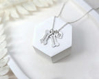 Customized dog bone name pendant for pet lovers worn by a model