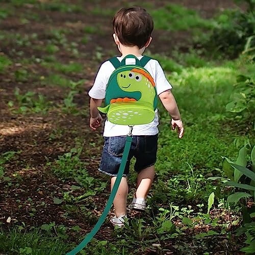 Child wearing Accmor dinosaur backpack in outdoor setting