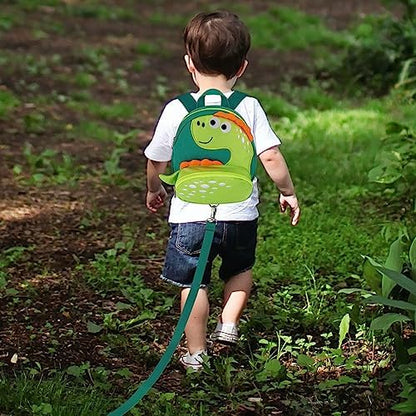 Child wearing Accmor dinosaur backpack in outdoor setting