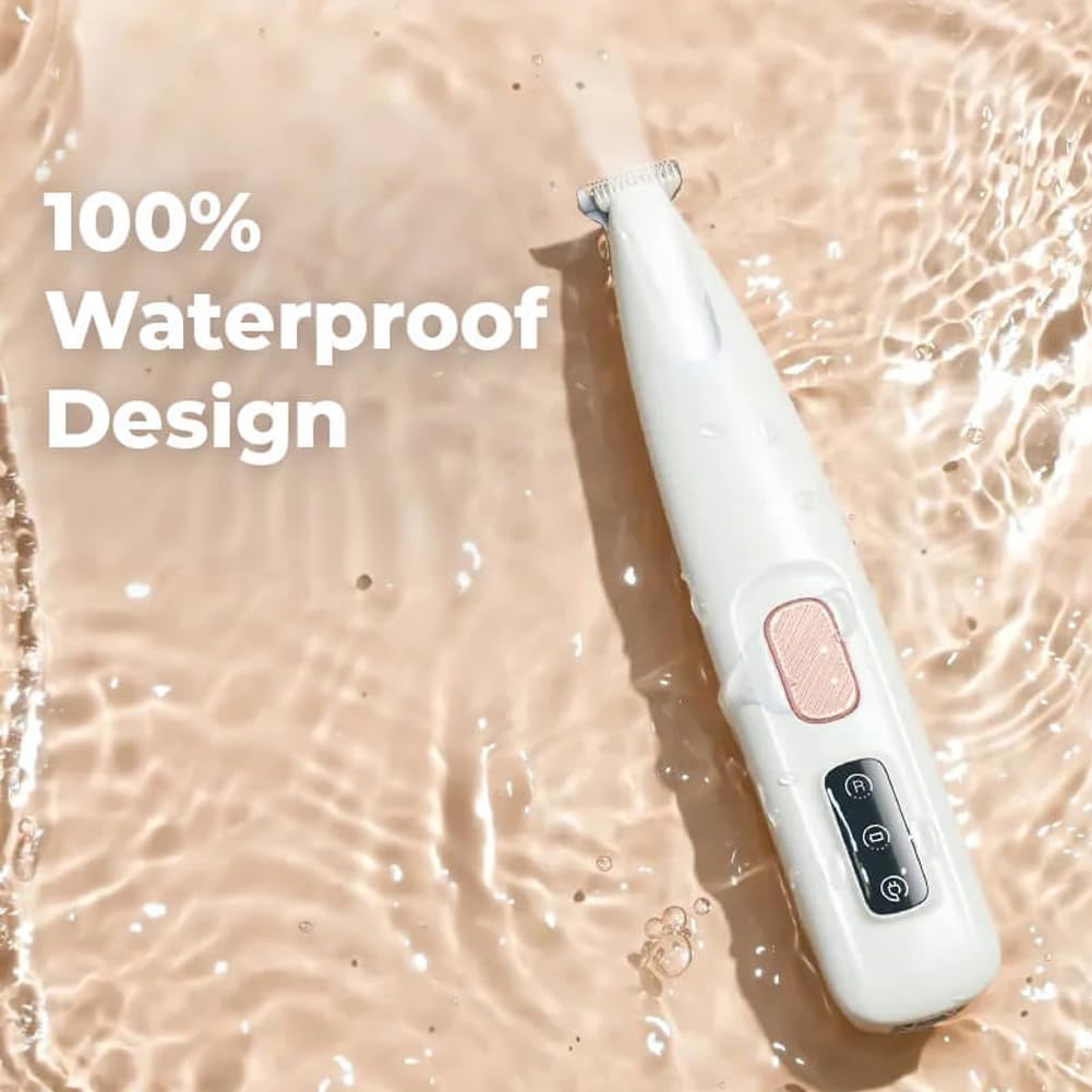 Waterproof cat paw hair trimmer being rinsed under running tap water for easy cleaning.