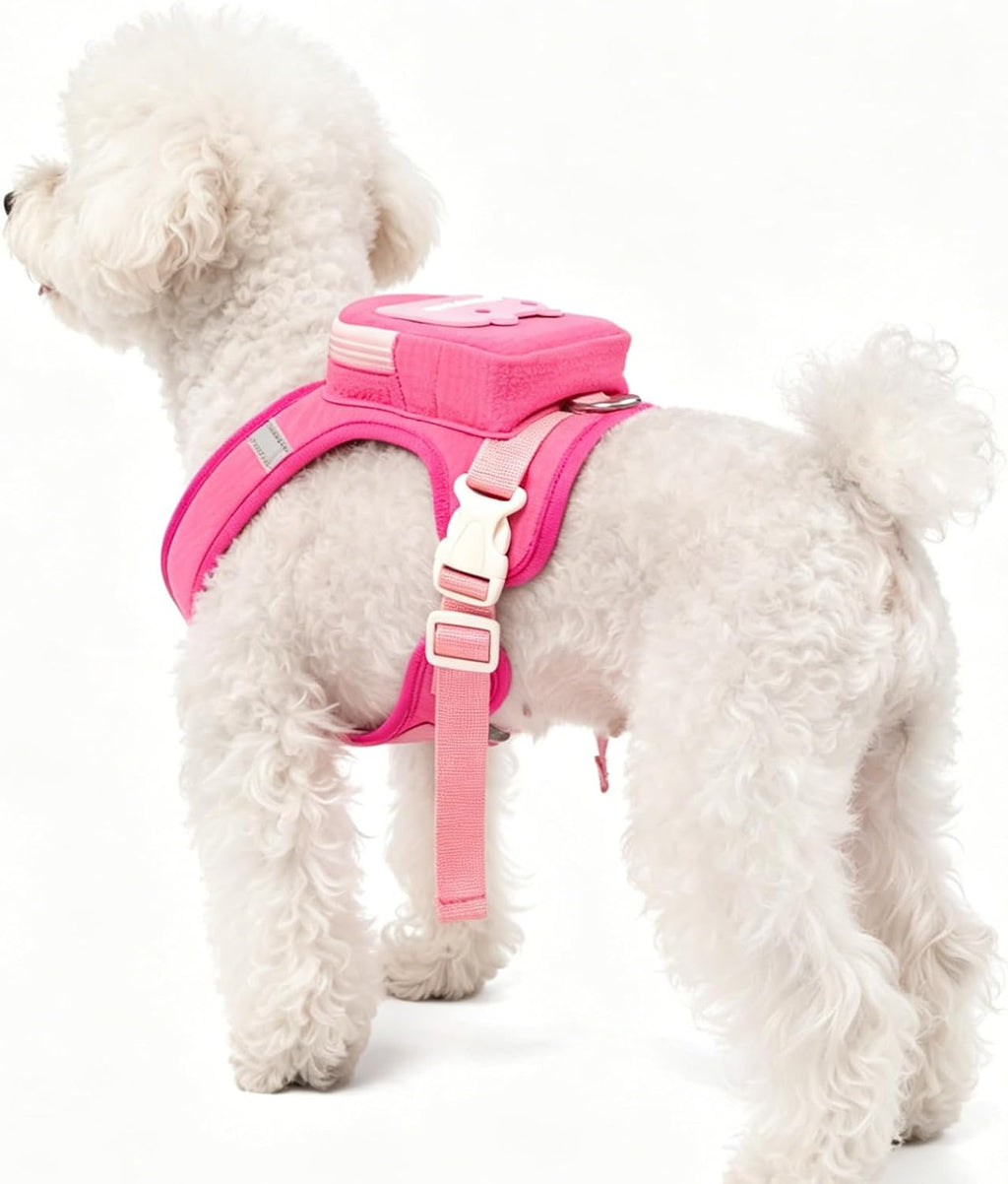 Side view of pink dog harness with storage pocket and leash attachment