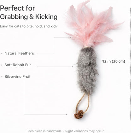 Three vibrant carrot cat toys with natural feathers