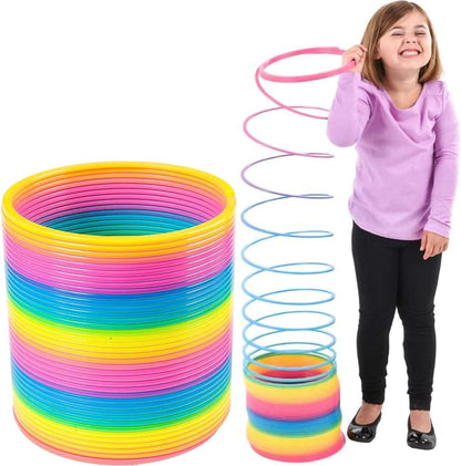 The Dreidel Company Jumbo Rainbow Plastic Coil Spring front view showing giant multicolor layers