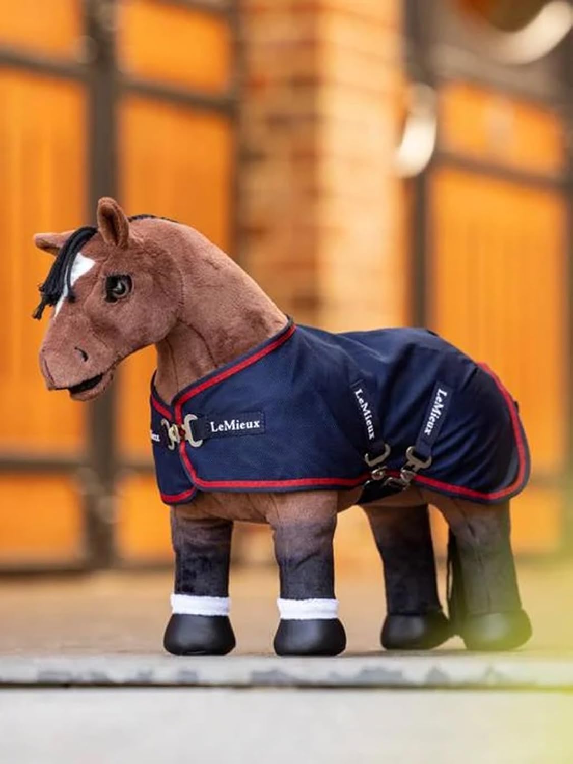 Detailed side profile of navy blue miniature toy horse blanket with chilli red trim