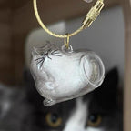 Sencdfly pet memory bottle open with a small lock of cat hair inside