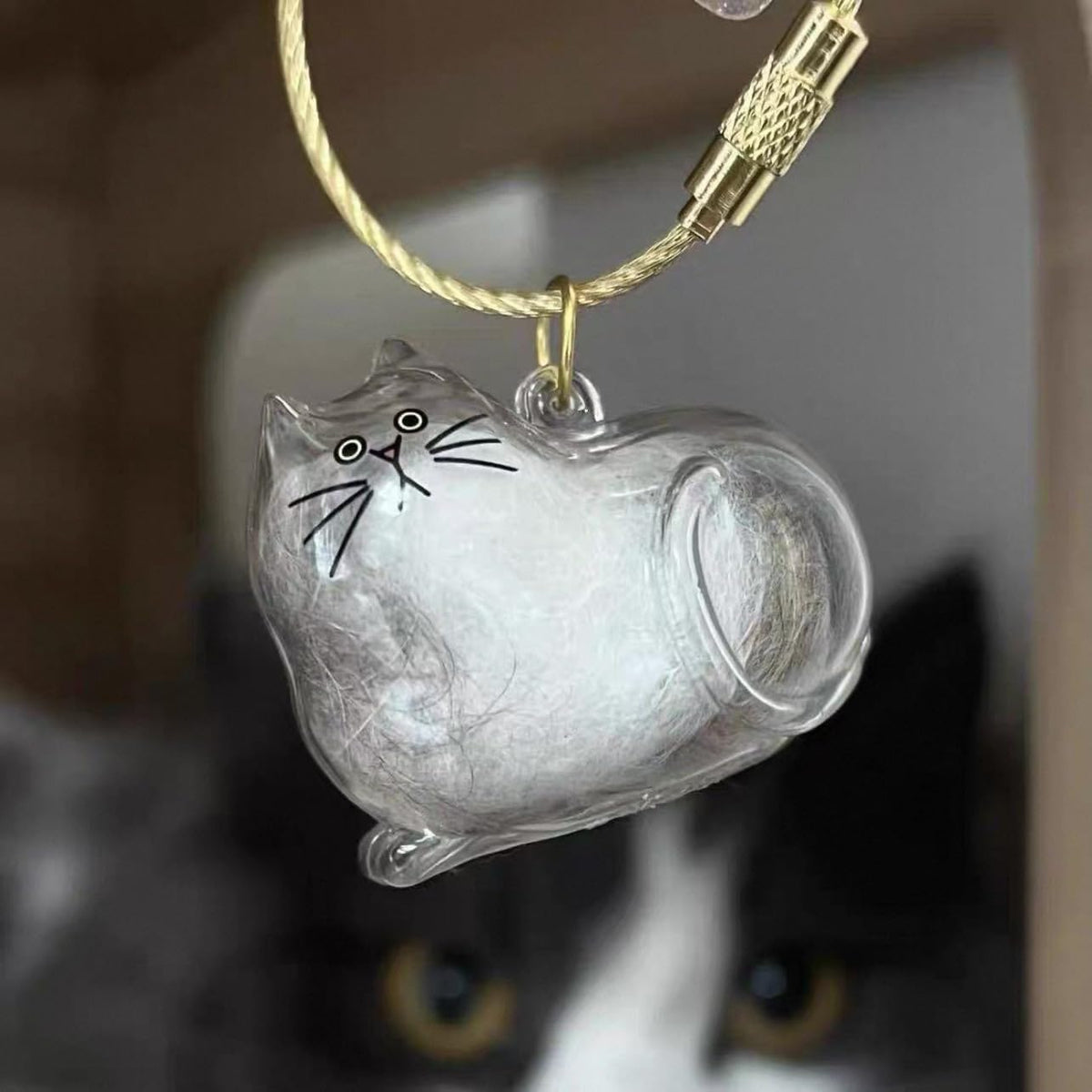 Sencdfly pet memory bottle open with a small lock of cat hair inside